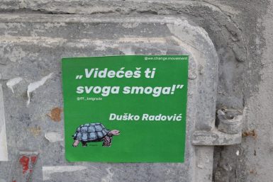green and white wall mounted signage